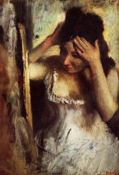 Woman Combing Her Hair Before A Mirror by Edgar Degas
