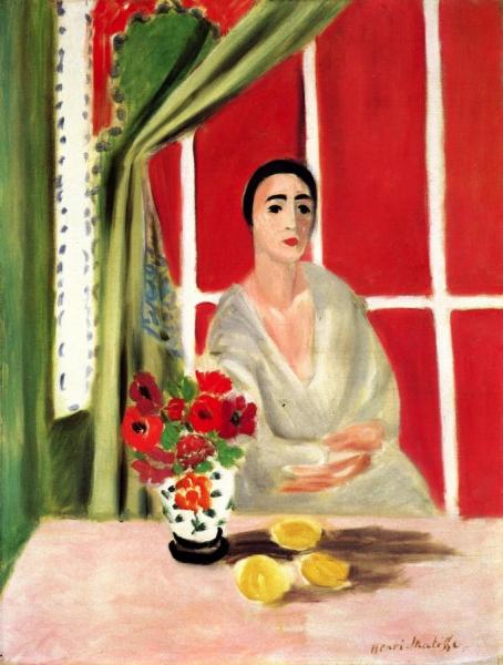 Seated Woman With A Red Screen In The Background by Henri Matisse