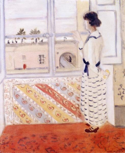 Young Woman At The Window, Blue Striped Desk by Henri Matisse