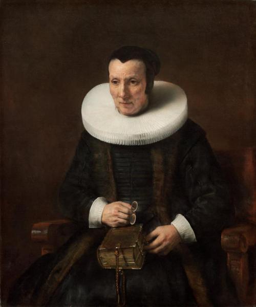 An Old Lady With A Book by Rembrandt Van Rijn