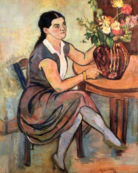 Woman Seated By A Bouquet Of Flowers by Suzanne Valadon